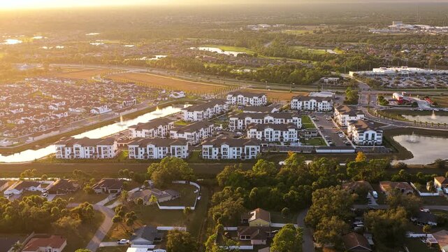 American condominium buildings in Florida suburb at sunset, reflecting real estate investment and residential planning in the region.