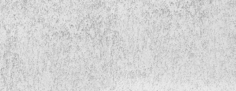 White cement wall showing rough textured surface