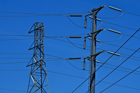 Old and new high voltage electrical pylons 