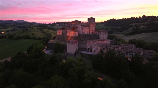 High angle aerial view of the historic Torrechiara Castle fortress perched on its terraced hill