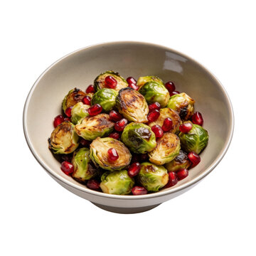 Roasted brussels sprouts with pomegranate seeds in a minimalist ceramic bowl