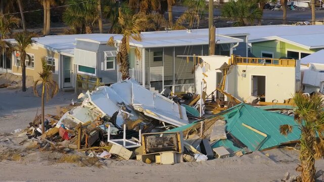 Hurricane Milton storm surge severe damage to waterfront house on Manasota Key, Florida. Destroyed home on gulf coast.