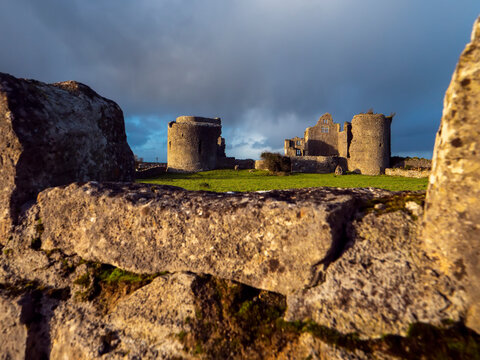 Stunning old fortress castle in Roscommon town, Ireland. Famous tourist attraction with nice green park and amazing view. Powerful stone wall and towers to protect important people. Irish history.