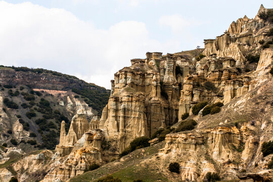 Scenic view of fairy chimneys rock formations and volcanic landscape caused by water and wind erosion