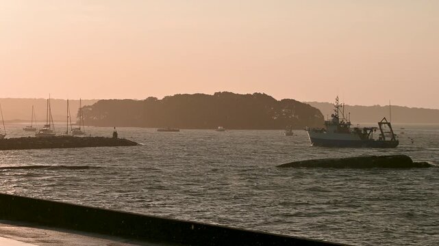 Groton, Connecticut, USA &ndash; Fishing Boat Returning To Port At Sunrise During Storm