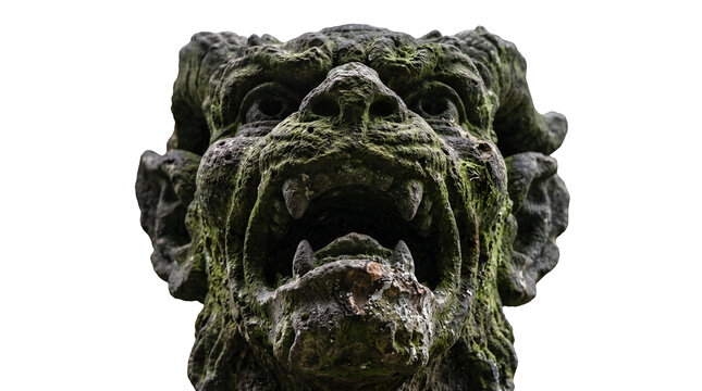 A close-up, low-angle shot of a moss-covered stone gargoyle with its mouth agape. The creature&rsquo;s eyes are wide and its teeth are bared, giving it a menacing appearance.