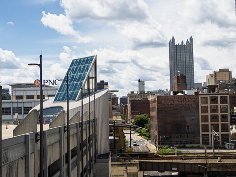 Pittsburgh downtown skyline views feature the gothic towers of PPG Place behind a modern geometric glass structure