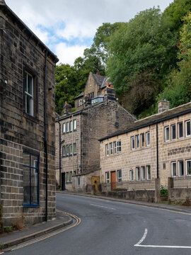 Bend on the road surrounded by traditional Yorkshire stone houses at Nutclough leading to Keighley road in Hebden Bridge West Yorkshire