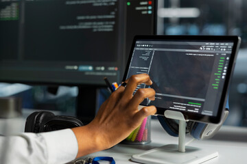 Fototapeta premium System operator works with digital tablet in a data center to support data processing, analytics, and storage infrastructure.