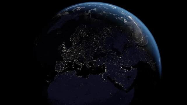 Europe at night from space, Italy, Spain, Portugal, United Kingdom. Slow zoom into a slow rotating planet Earth.