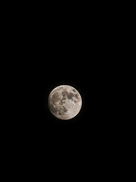 Full moon with dark clouds in the night sky