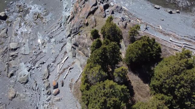 Top-down aerial view showcases a 450-million-year-old geological formation shaping the rugged Pointe-Leggatt shoreline.