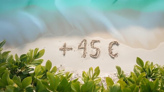 inscription on the sand + 45 C, tropical leaf, wave