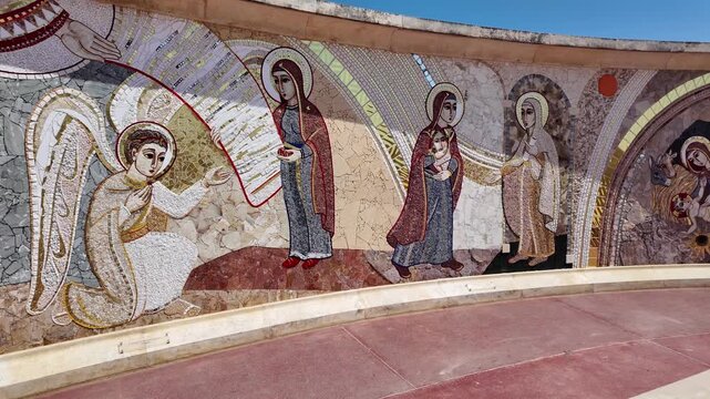 Gharb, Gozo, Malta 29.06.2026 - Sanctuary Basilica of the National Shrine of the Blessed Virgin of Ta' Pinu. The large, vibrant mosaic walls depict the Joyful, Luminous, Sorrowful, and Glorious Myster