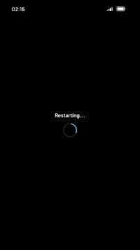 Smartphone System Update Screen with Dark Mode Interface Triggering Immediate Device Restart and Loading Progress Indicator