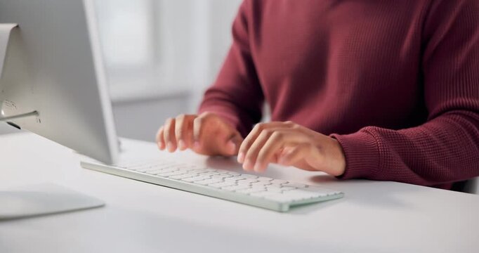 Person typing on computer keyboard in slow motion