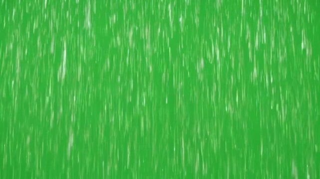 Heavy rain falling down on green screen background weather storm water drops