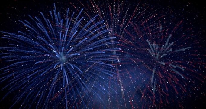 Fireworks - patriotic fourth of july firecracker display exploding in the night sky with red, white, and blue sparkles