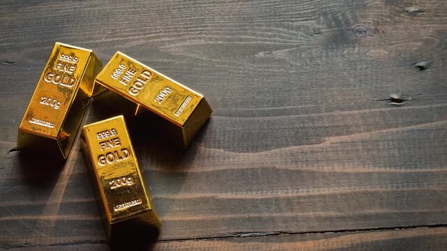 Gold bars and US dollar banknotes on wooden table with sunlight, symbolizing wealth, investment, finance, savings, and safe assets.