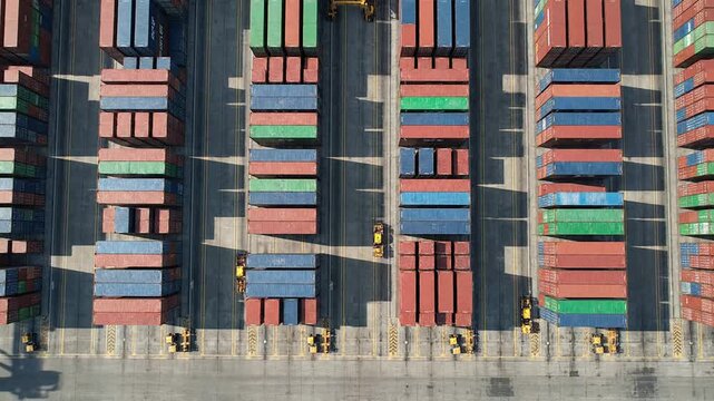 Static Top-Down Bird's Eye View of a Container Terminal Layout with Shipping Containers Densely Arranged for Efficient Logistics and Transportation