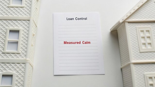 Loan Control Document with Words Measured Calm Surrounded by Miniature Plastic Houses on Neutral Background