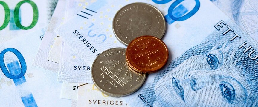 Swedish krona money bills and coins on table. Sweden cash of SEK currency close up