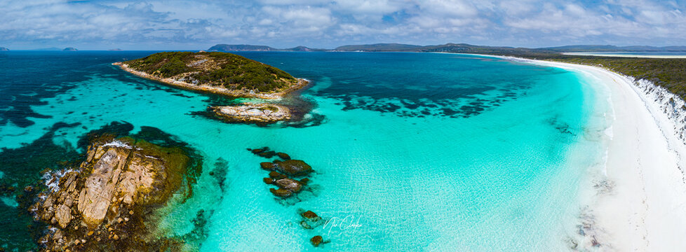Aerial view of the turquoise waters and white sand of Goode Beach with rocky outcrops and coastal vegetation in Goode Beach, Western Australia, Australia.