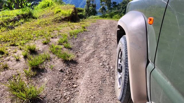 Off-road vehicle driving on a rough country dirt road
