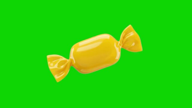A glossy 3D animated yellow wrapped candy or bonbon floating at an angle. Set against a solid chroma key green screen background, this sweet confectionery asset is ideal for holiday, birthday, or tric