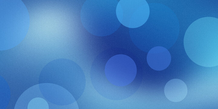 Abstract background with blue bokeh circles and grainy texture creates soft atmospheric light effect for modern digital projects.