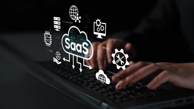 Hands Typing on Laptop with SaaS Icons Representing Cloud Computing, Data Management, and Software Services in Dark Environment. Entropy.