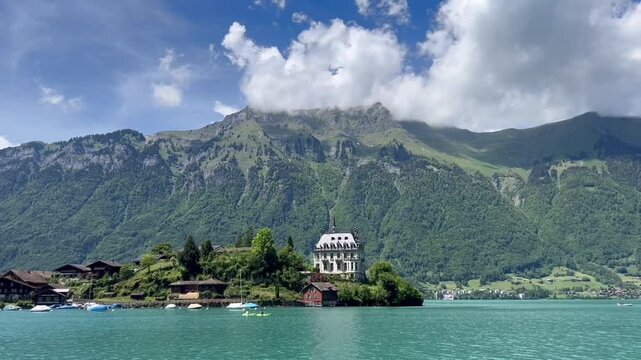Scenic panorama of Iseltwald and Lake Brienz in Switzerland POV