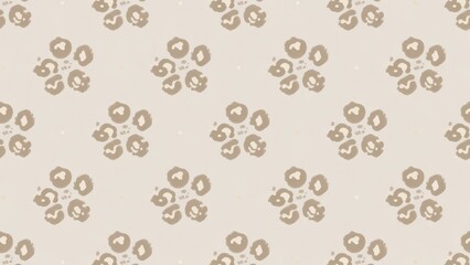 A repeated textile motif displaying soft brown organic leopard print shapes arranged in a symmetrical floral formation across a muted light tan surface creating an aesthetic organic nature textur
