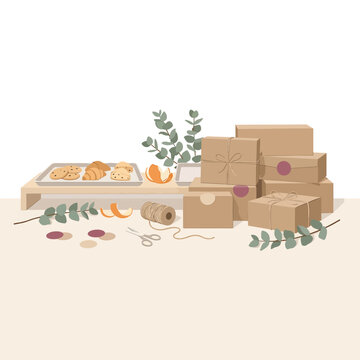 Eco friendly packaging station with cardboard boxes and botanical decorations for small business shipping.