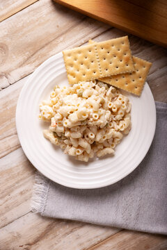 Macaroni Tuna salad with elbow pasta and canned tuna, served with saltine crackers. Easy and healthy recipe.