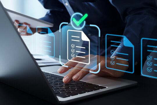 Legal document review and management. Document approval process and workflow. Businessman using compliance automation system on laptop computer for regulatory checks.