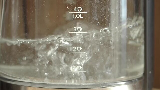 Boiling water reaching the one liter mark in a kettle