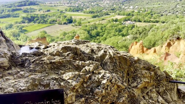 Site marker les Cheminees des Fees and a sweeping view over golden