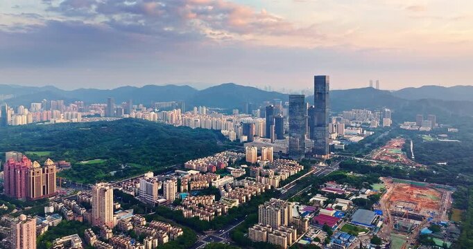 Aerial view of modern skyscrapers and a green urban park in Shenzhen, China