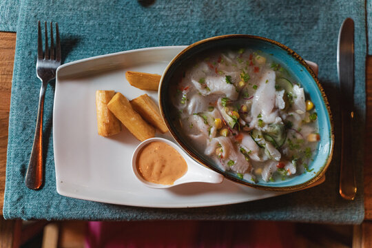 Ceviche bowl with fried yuca and sauce
