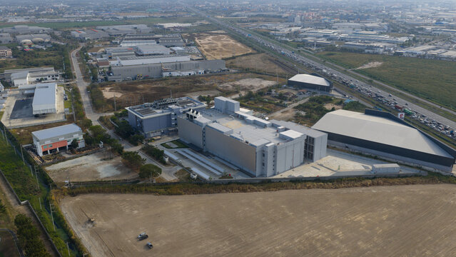 Tambon Don Huaro, Thailand - 11 February 2026: Aerial view of the NTT Global Data Centers Thailand Limited facility featuring large industrial cooling towers and HVAC systems on the rooftop.