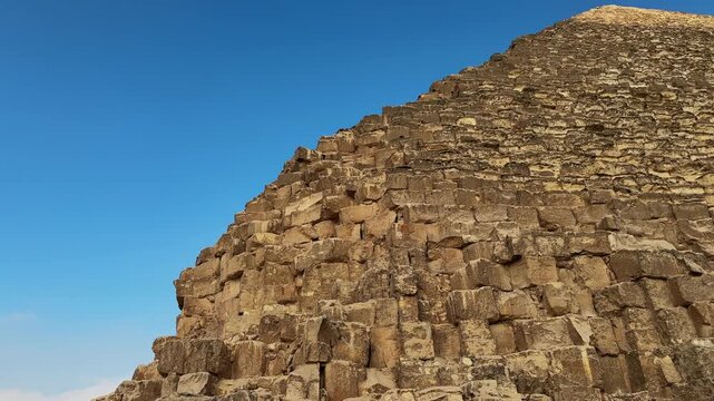 Close Up Tilt Motion Shot along the Limestone Block Masonry of the Great Pyramid of Khufu at Giza Necropolis