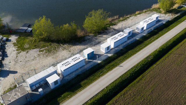 Zwolle, Netherlands - 23 April 2026: Aerial view of Tesla Megapack BESS Next to Floating Solar Park