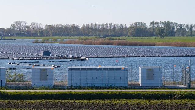 Zwolle, Netherlands - 23 April 2026: Aerial view of Tesla Megapack BESS Next to Floating Solar Park