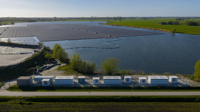 Zwolle, Netherlands - 23 April 2026: Aerial view of Tesla Megapack BESS Next to Floating Solar Park