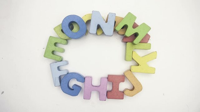 The alphabet with the letter o, wooden letters on paper 