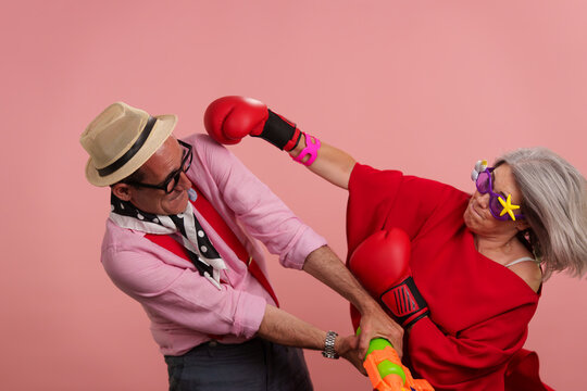 Older couple acting playful celebrating active maturity
