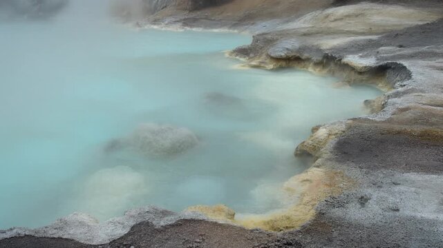 Steam rising from turquoise crater lake at Taal Volcano