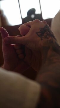 Close-up of therapist performing reflexology treatment