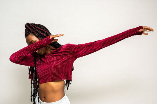Woman dabbing in red sweater.